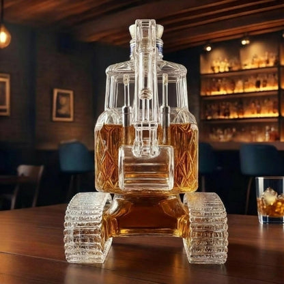 Front-facing view of the Kouvr glass excavator liquor decanter, showing the intricate detail of the tracks, cab, and boom arm.