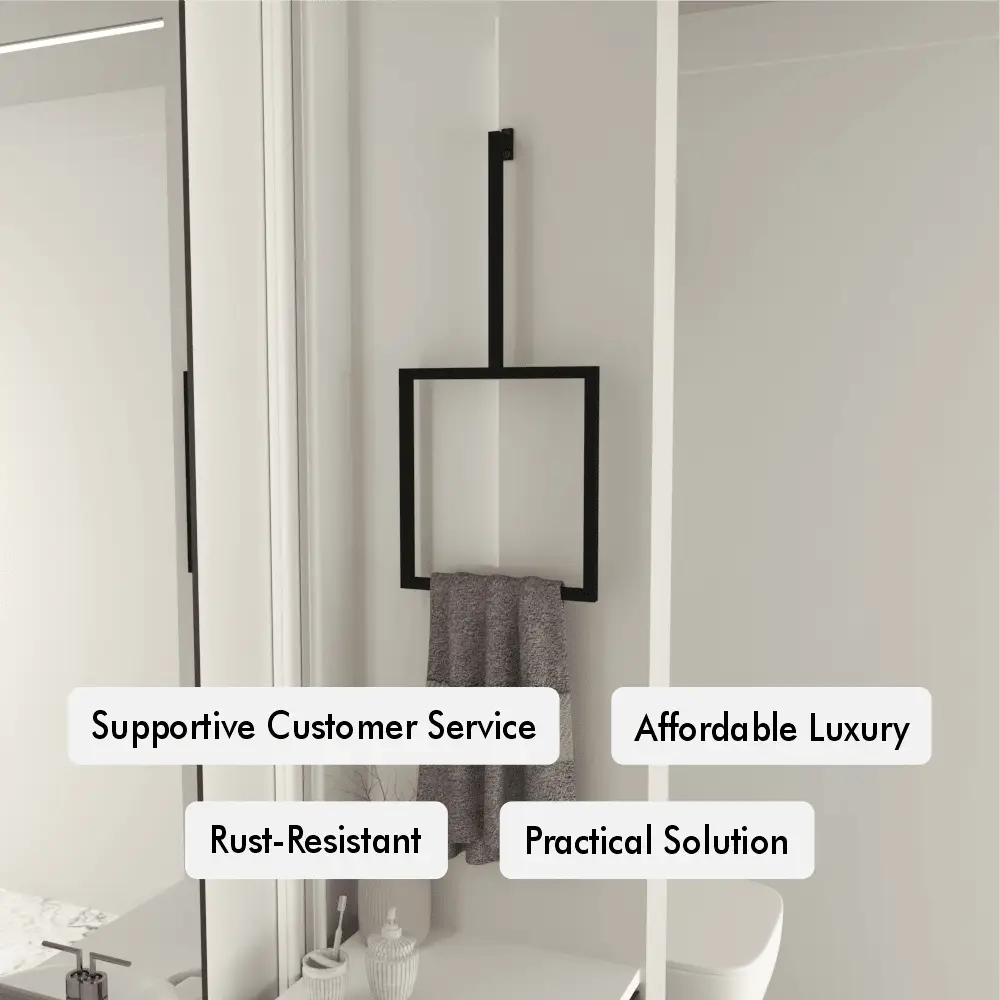 A modern black vertical towel ring is mounted on a white bathroom wall, holding a gray towel.